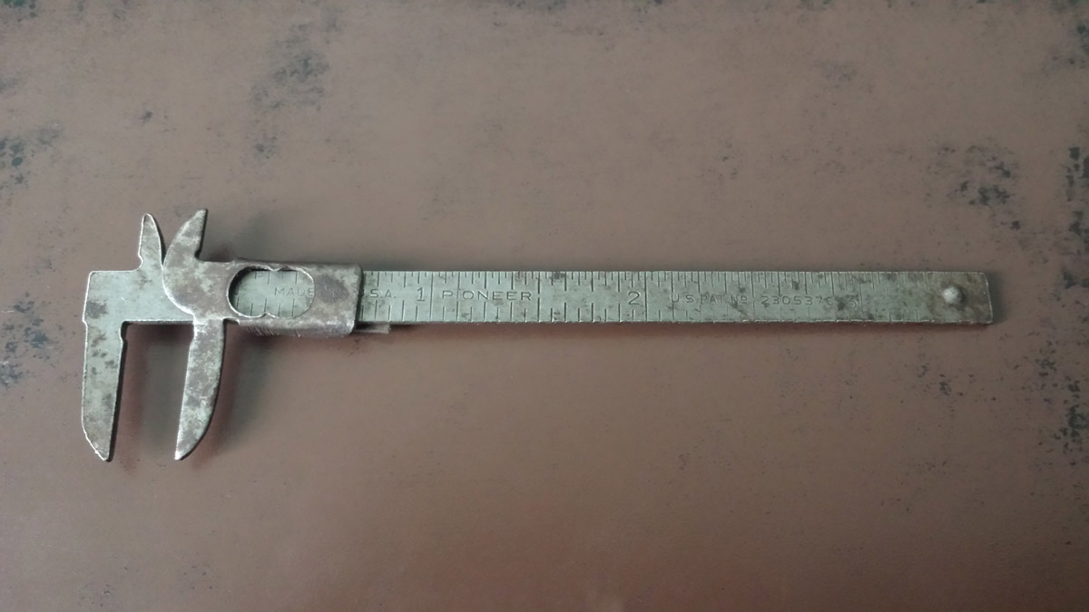 Top view of a vintage caliper.