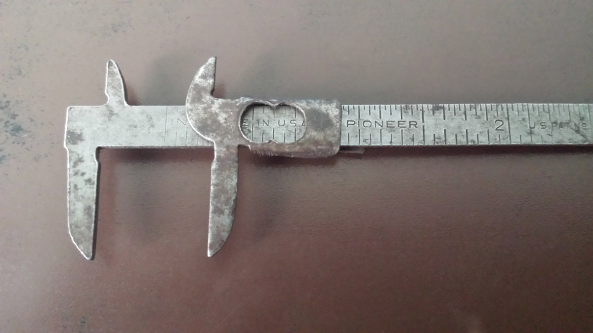 Close up top view of a vintage caliper.