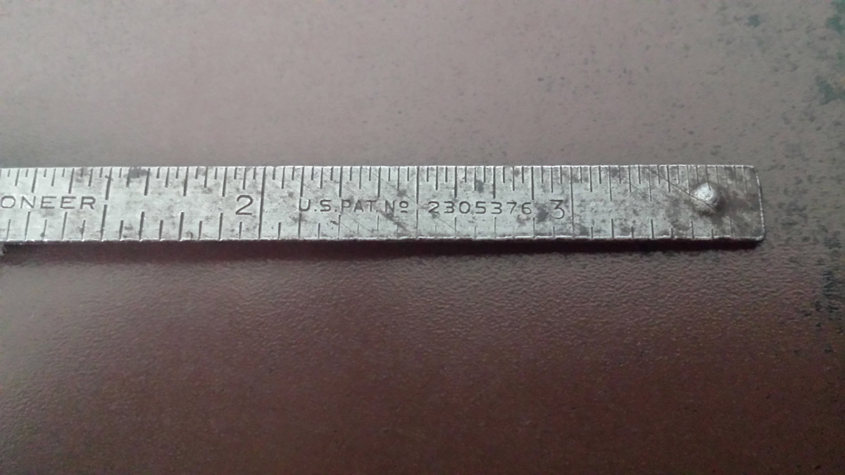 Close up top view of a vintage caliper.