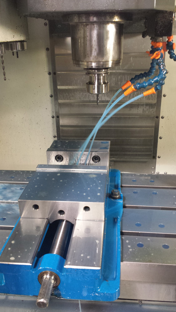 Closeup view of new coolant spraying.