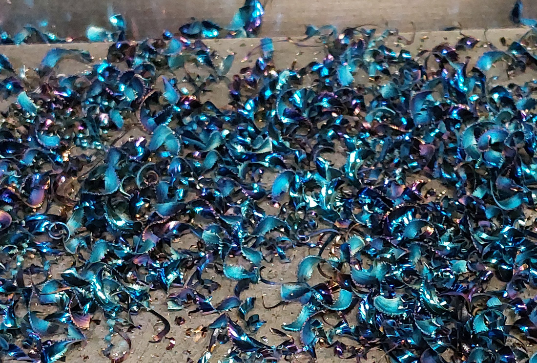 Chips from cutting D2 tool steel.