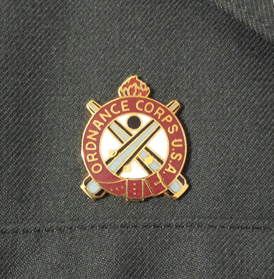 US Army Ordnance Corps insignia.
