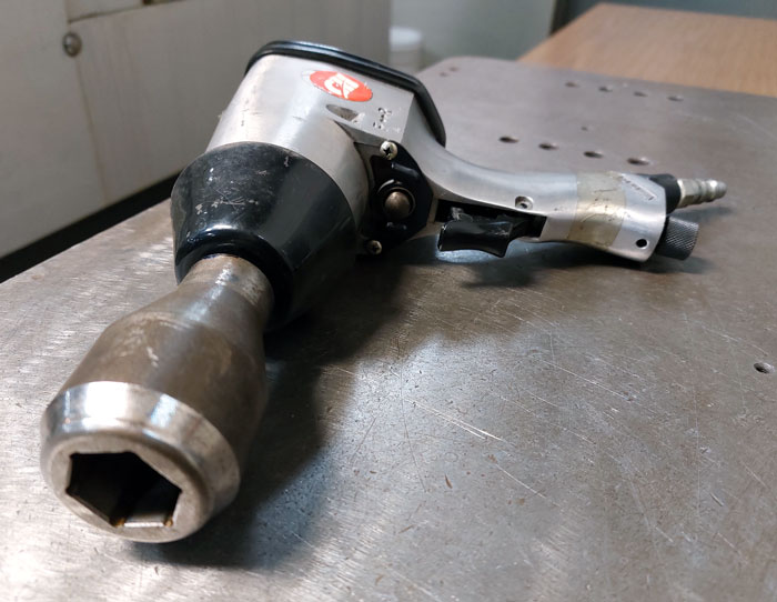 The adapter mounted on the impact wrench.
